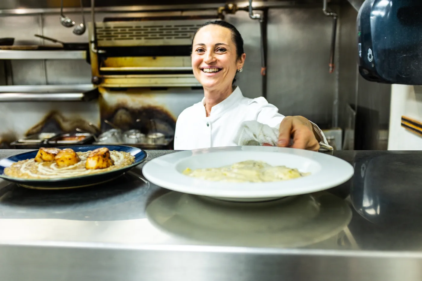 Chef Laura Migliorini cooking in the Milano kitchen