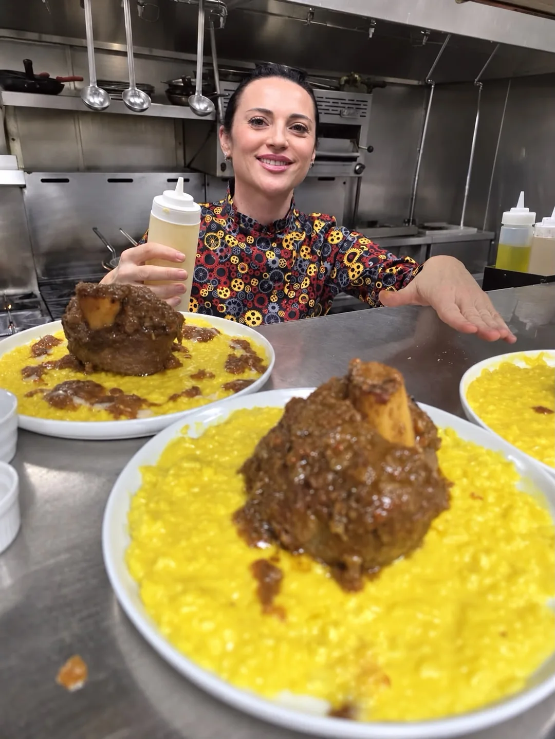 Chef Laura Migliorini with her ossobuco and saffron risotto in the Milano kitchen