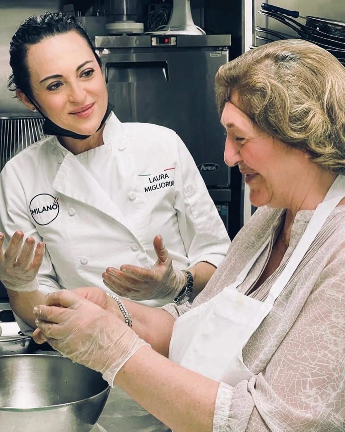 Chef Laura Migliorini preparing food in the Milano kitchen