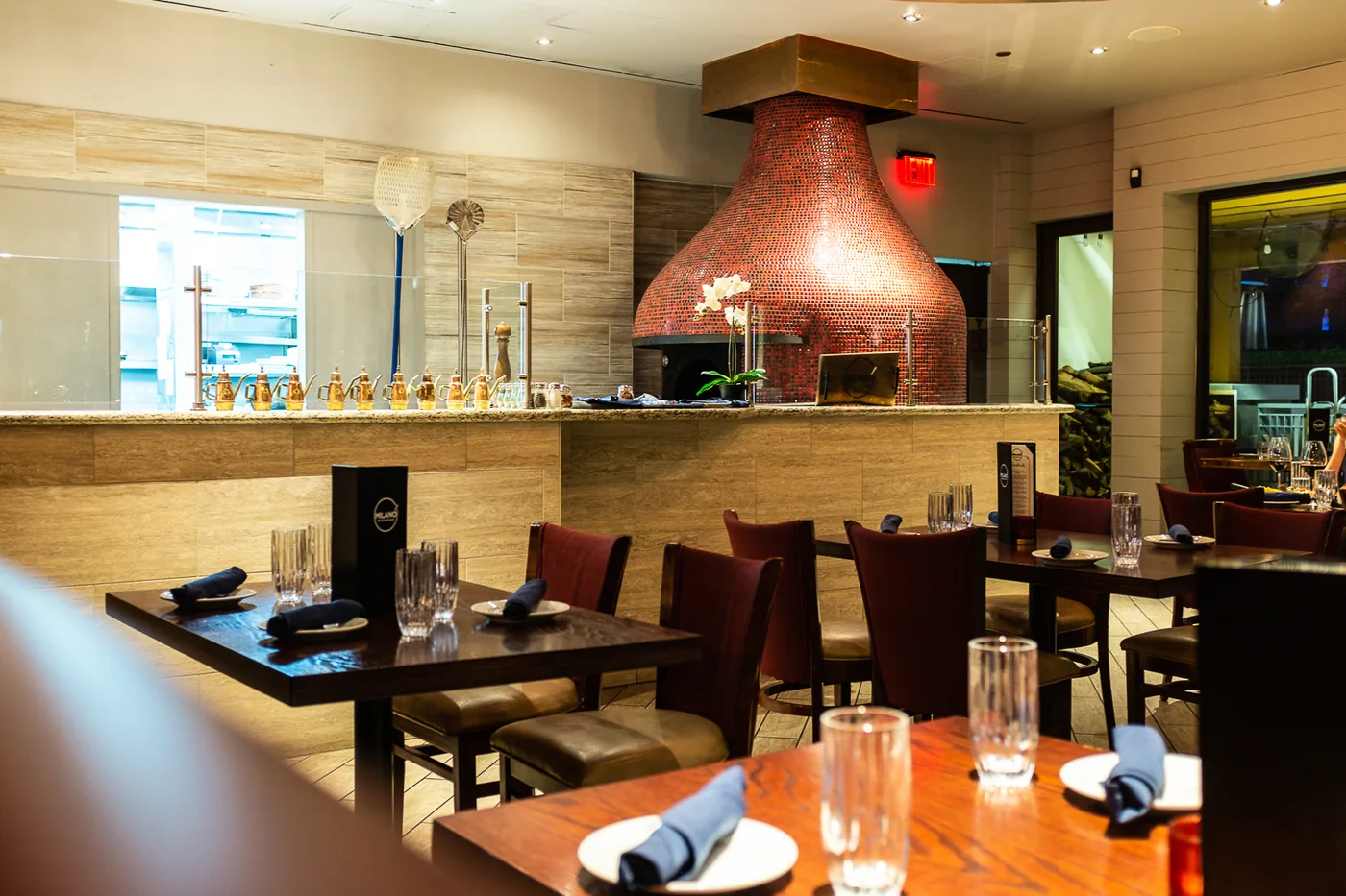 Milano dining room with the copper wood-fired oven