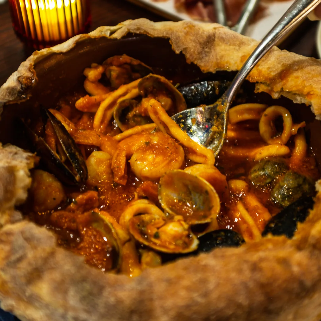 Cavatelli ai Frutti di Mare al Forno Milano, the signature dish