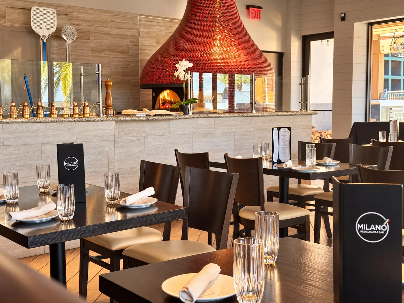 Milano dining room with the copper wood-fired oven