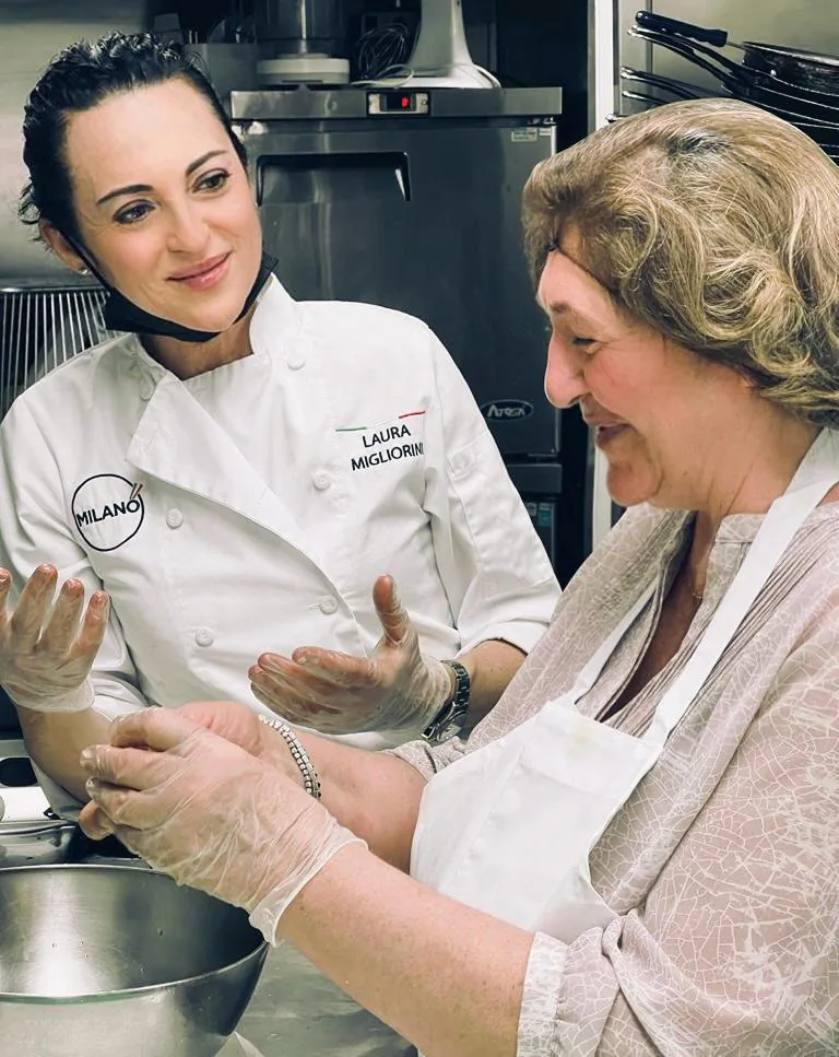 Chef Laura Migliorini cooking in the Milano kitchen